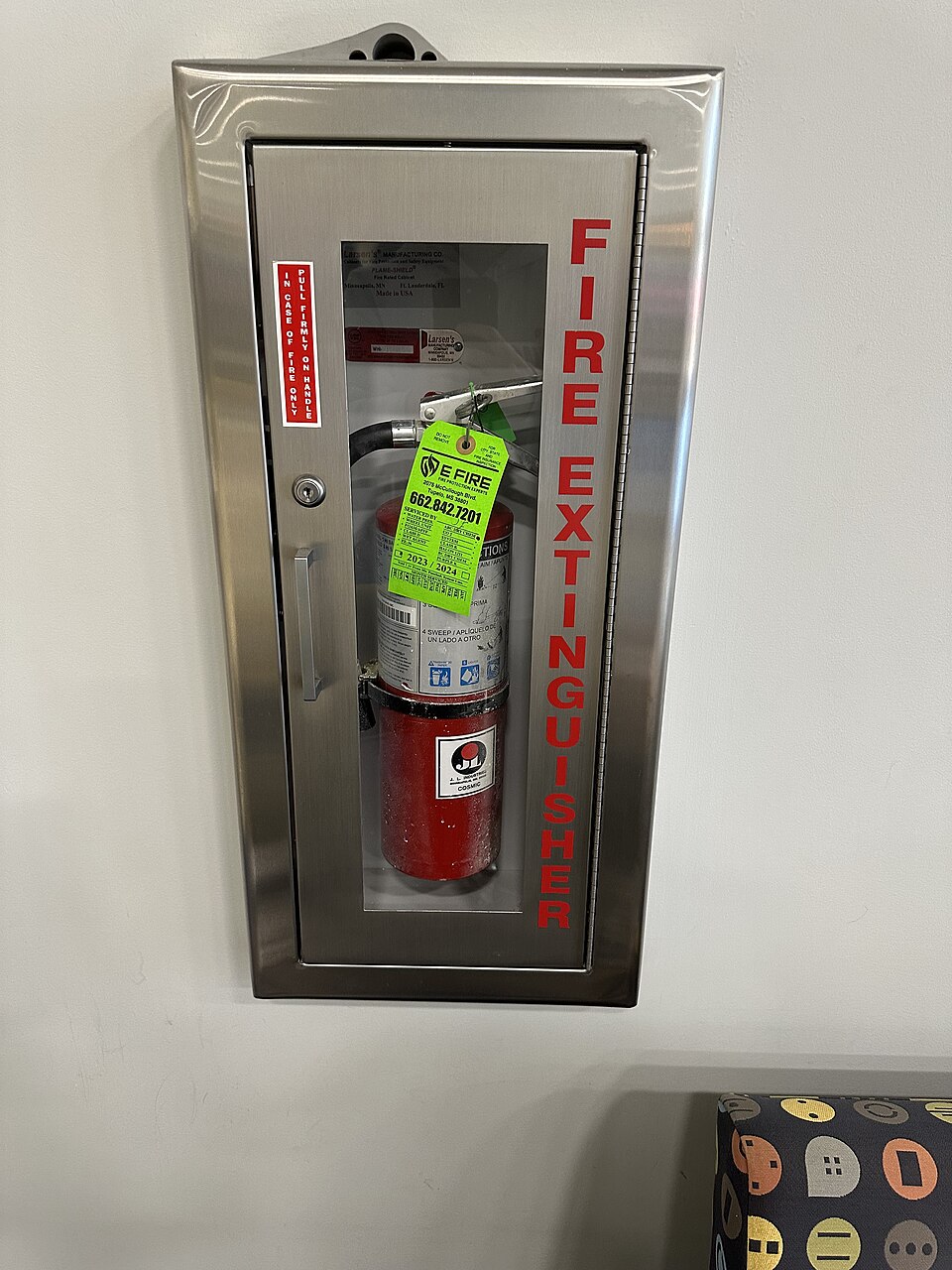 Fire extinguisher cabinet with ready-to-use safety equipment